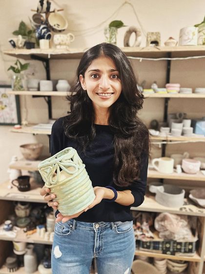 This student explored all four major techniques in her beginner's course, creating these beautiful pieces, including a delicate pierced vase and a little house luminary.