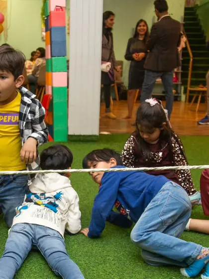 How low can you go? We organize classic group games like limbo to get everyone moving, laughing, and playing together, making it a perfect activity for birthday parties and playdates.