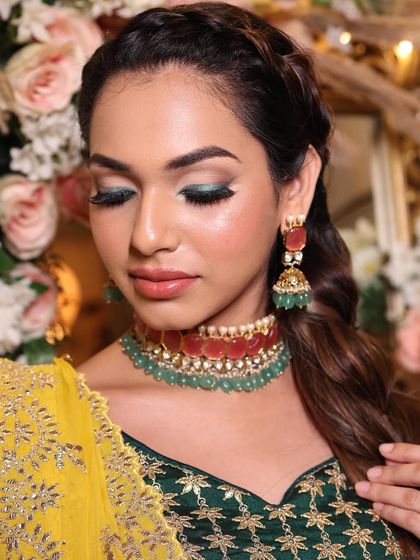 A close-up of the stunning green winged eyeshadow. This is a perfect example of how to incorporate color into your bridal look in a sophisticated way.