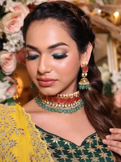 A close-up of the stunning green winged eyeshadow. This is a perfect example of how to incorporate color into your bridal look in a sophisticated way.