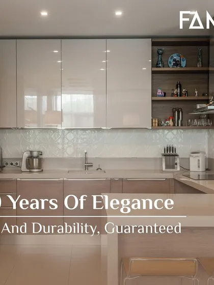I guarantee 10 years of elegance and durability. This kitchen, with its high-gloss beige cabinets and wood accents, is a perfect example of a design that will remain stunning and strong over time.