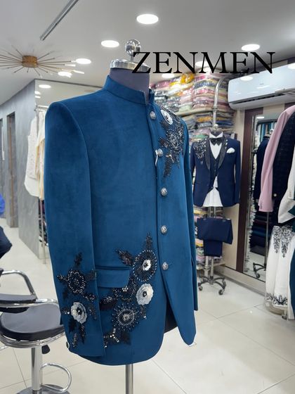 The teal velvet Jodhpuri on display in my store. This piece is a testament to my commitment to creating unique, handcrafted designs.