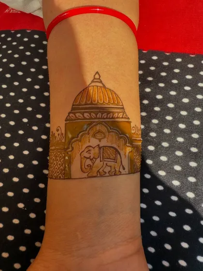 A custom design featuring a royal elephant in front of a palace dome. This is a great example of how I can incorporate architectural and animal motifs into your mehndi.