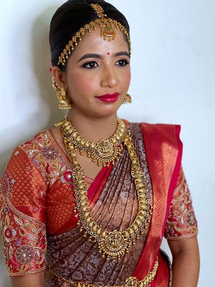 A portrait showing the bride's complete look. The makeup is designed to be bold yet elegant, ensuring she looks her best on her wedding day.