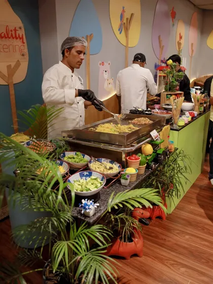A full view of our live noodle station, complete with a wide array of fresh vegetables and sauces for guests to customize their dish.