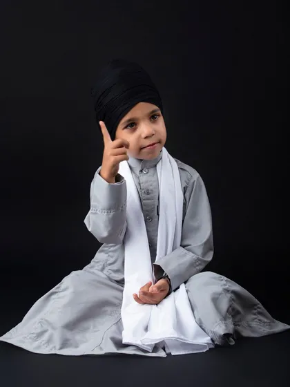 A thoughtful portrait of a young Sikh boy. I love capturing these moments of quiet confidence.