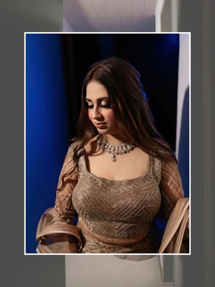 A close-up portrait of the bride, framed by a modern, geometric border. Her soft makeup and the clean edit create a chic and polished look.