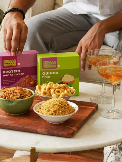A weekend vibe shot with healthy snacks and drinks, perfect for targeting a younger audience looking for "chakna" alternatives.