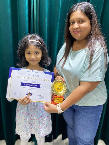 Aayushi Shear from Blossom School with her certificate and trophy for completing the Abacus Junior Level. Great start!