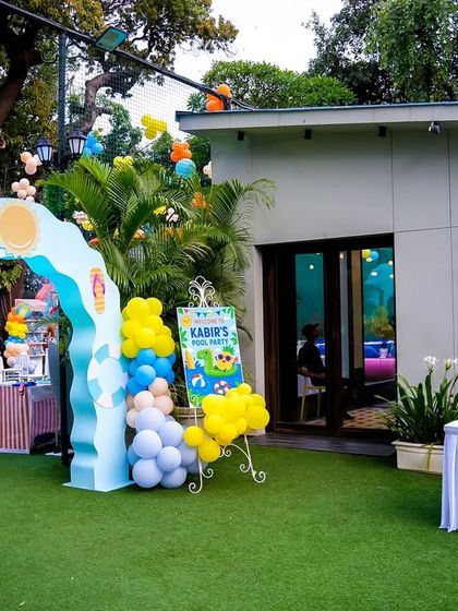 The party entrance at 'The Outhouse' venue, showing how I transform a space from the moment guests arrive with themed arches and balloon decor.