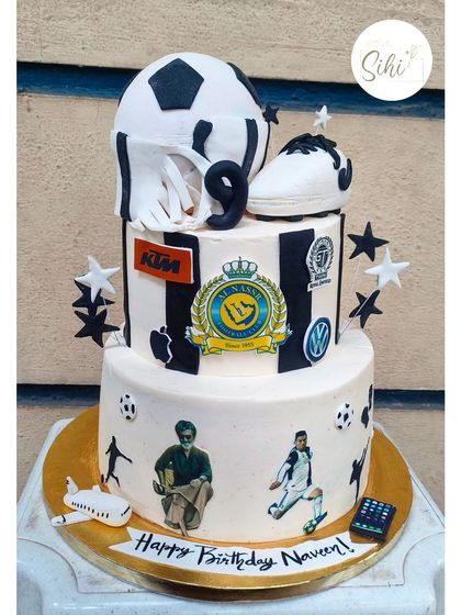A little bit of everything. This three-tier cake incorporates all of the birthday person's favorite things: football, various car brands, kickboxing, and even the superstar Rajnikanth.