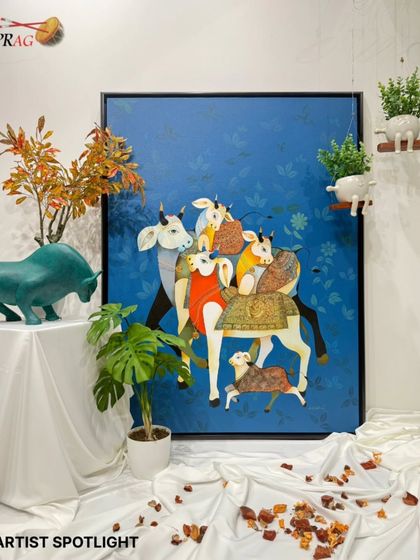 An artist spotlight shot of Ashok Nellagi's bull painting, styled in the gallery to highlight its scale and vibrant presence.