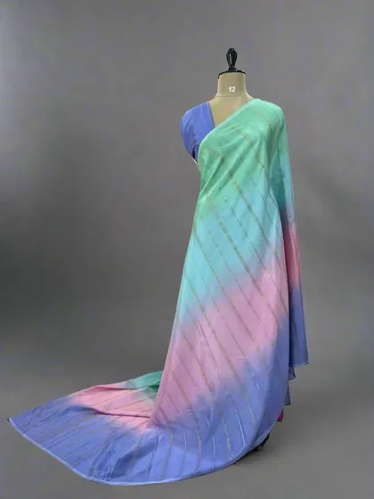 A vibrant Rangkat pure Mysore silk saree with shades of green, pink, and blue.