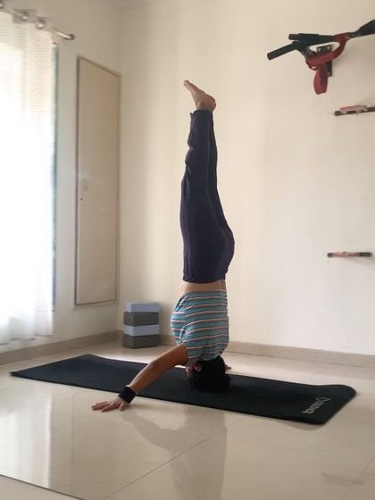Mukta Hasta Sirsasana, a tripod headstand variation. Inversions have the power to shift the flow of energy in our bodies and in our lives, bringing fresh perspective.
