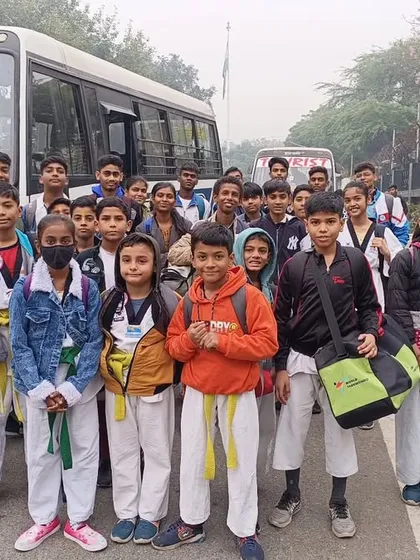 Team ASHA arriving by bus for the Open National Taekwondo Championship at Talkatora Indoor Stadium.
