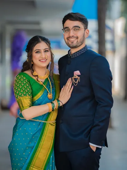 A classic portrait of Ameya and Gautami. This shot is perfect for showing off their coordinated traditional outfits and their happy smiles.