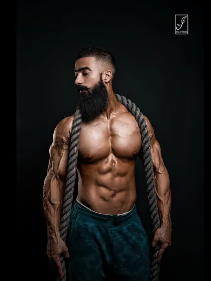 Strength isn't just about muscle, it's about presence. Here, I used a heavy battle rope as a prop to complement the athlete's powerful physique and intense expression, creating a raw and compelling image.