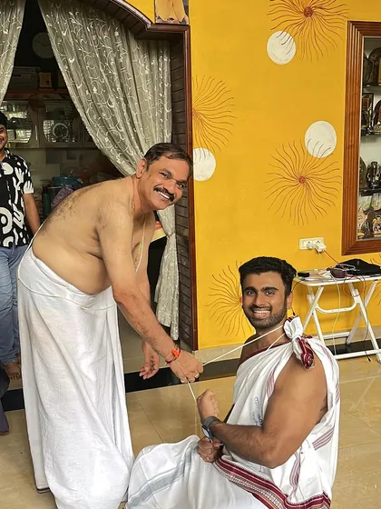 Participating in the Upakarma ceremony with my father. It's important to stay connected to my culture and traditions.