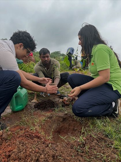 Our team guides students from The Shri Ram School on the proper technique for planting. These educational moments are as important as the planting itself.