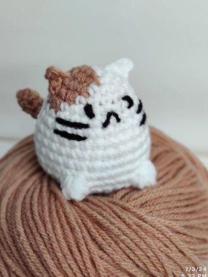 My collection of chubby cat keychains. These little guys come with different colored patches on their heads, including yellow, green, pink, blue, and grey.