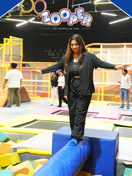 Finding your balance on the rolling log over the foam pit is a fun challenge for everyone.