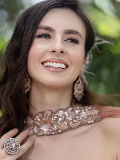 This close-up shows the flawless, glowing skin and subtle eye makeup that define our signature nude look.