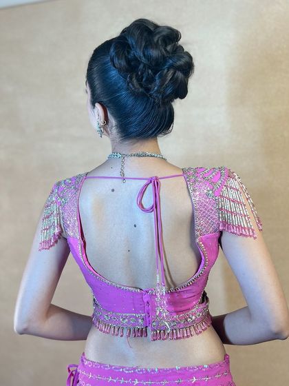 A back view of the high braided bun, highlighting its beautiful shape and structure.