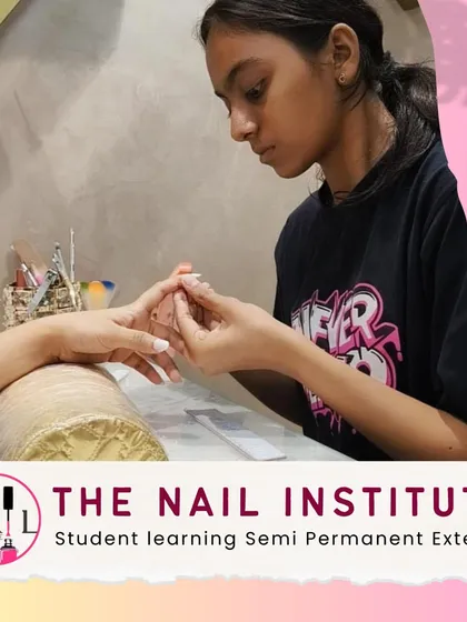 This student is learning how to apply semi-permanent extensions, a durable option for long-lasting nail enhancements.