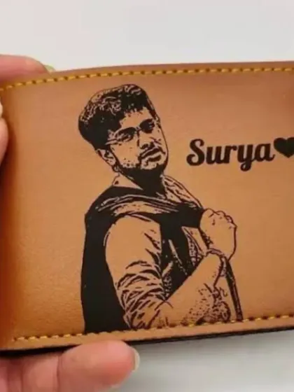 Add an extra personal touch to a wallet by engraving a photo on it. This tan vegan leather wallet features a detailed sketch created from a customer's photo, along with his name.