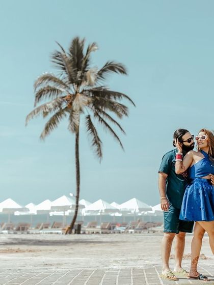 A candid moment of affection on the beach. We look for natural interactions that showcase the couple's love story against a beautiful landscape.