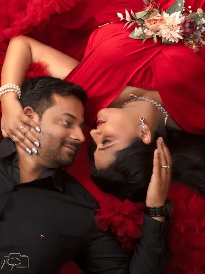 A close-up of the connection between two parents-to-be. This intimate overhead portrait captures the love and anticipation in their eyes as they share a quiet moment.