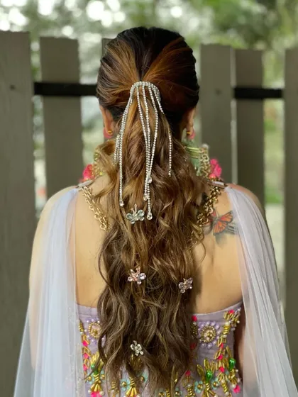 A closer look at the rhinestone and butterfly ponytail, showing the intricate details that make this hairstyle so special and fun.