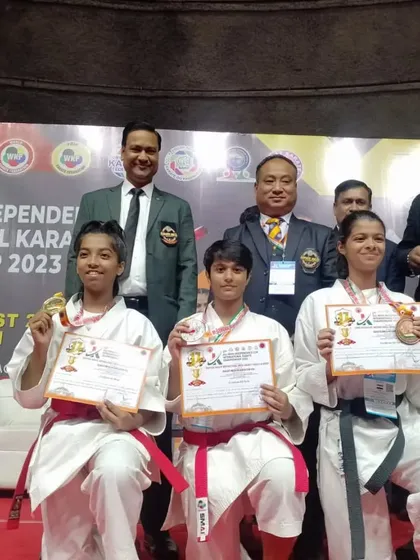 Our girls team displaying their hard earned medals. We train female athletes to be strong, confident, and victorious.