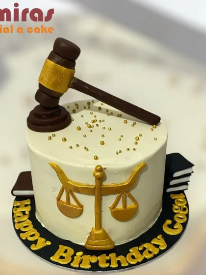 Celebrating a legal professional's birthday, this cake features the scales of justice and a judge's gavel. It's a great example of how I can turn any profession into a unique and delicious theme.