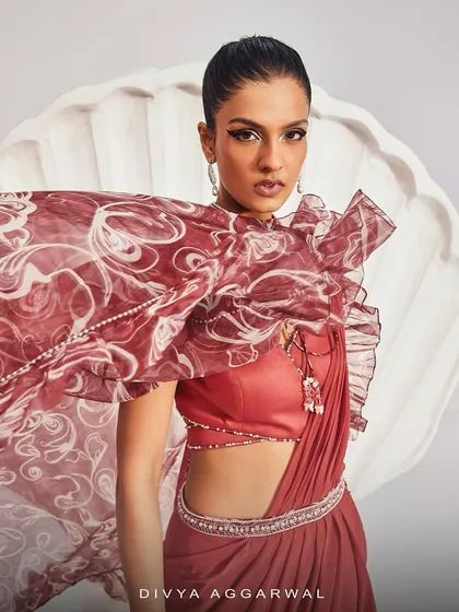 A close-up of the Serena Saree Set, highlighting the embellished collar and the ruffled texture of the dramatic printed cape.