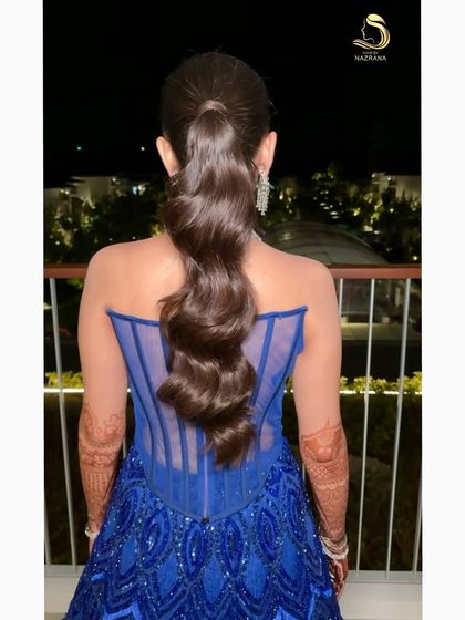 A soft, wavy ponytail for my bride's unforgettable cocktail night in Thailand. Simple, elegant, and chic.