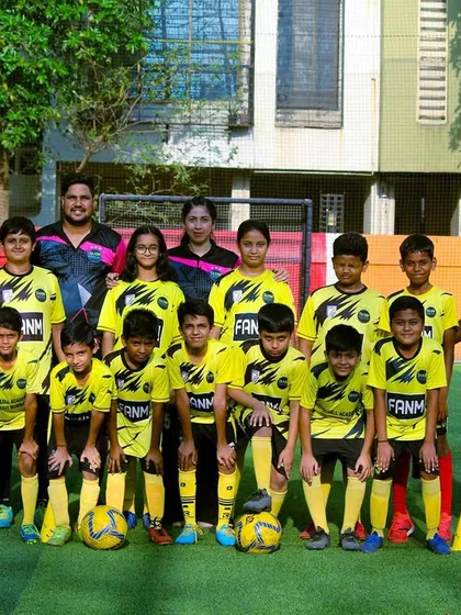 A group photo of our intermediate players and their coaches, showcasing the growth and progress at FANM.