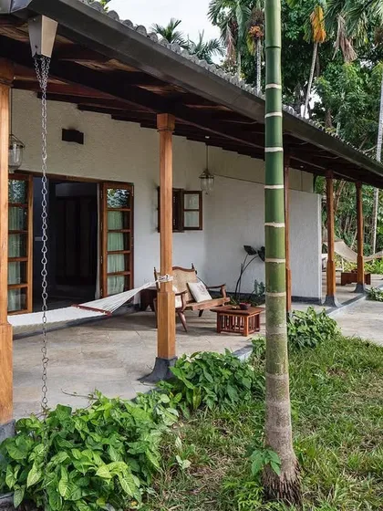 The private veranda of a Garden Suite room, showing how the living space extends into the landscape.