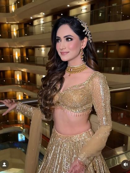 An unforgettable engagement look with intricate curls and a beautiful hair accessory.