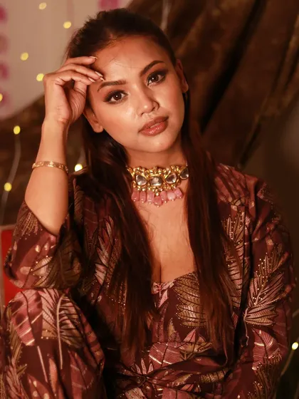 A perfect look for the upcoming wedding season. This shot showcases a warm, bronzy smokey eye and a defined lip, paired with a beautiful statement choker.