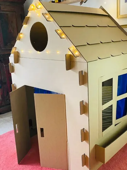 A closer look at the details of our large playhouse, featuring a window box, a round attic window, and easy-open doors. It’s a durable and safe space for imaginative play.
