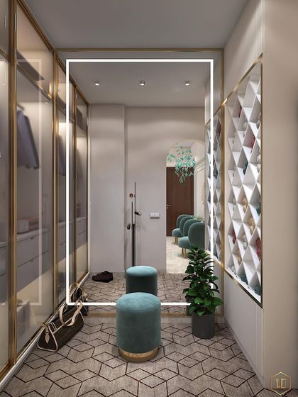 A walk-in closet with a large backlit mirror. The design includes glass-fronted wardrobes and a dedicated shoe storage unit with a diamond pattern.