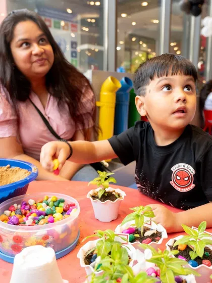 Our parties include hands-on activities to keep every child engaged. Here, kids are getting creative with a planting workshop, adding a unique touch to a Spiderman-themed day.