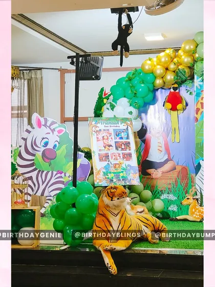 A detailed shot of the jungle party decor, showing a plush tiger, a zebra cutout, and a hanging monkey prop. These elements add a fun and interactive feel to the overall setup.