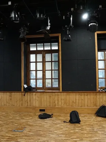 The restored heritage windows of the Black Box Theatre, which can be blacked out for performances or left open to fill the space with natural light.