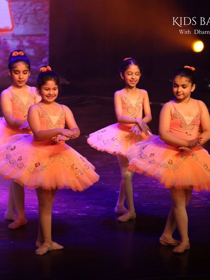 A look at our little ballerinas lighting up the stage. Their performance was a beautiful display of artistry and discipline, choreographed to bring out their natural grace and joy for dance.