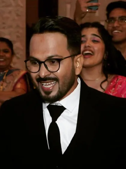 Caught in a moment of laughter, his makeup remains flawless. I use high-quality products from brands like MAC and PAC to guarantee a long-lasting finish that withstands the energy of a wedding party.