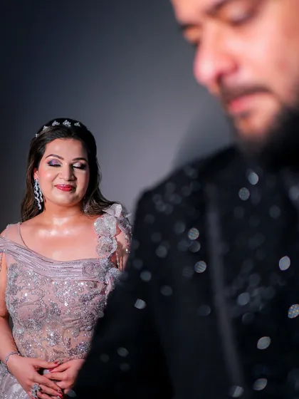 An artistic close-up of the bride. Her makeup is subtle and glowing, with a focus on her radiant skin.