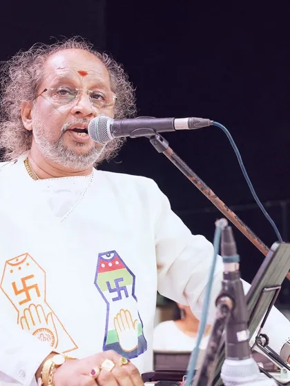 A devotional singer performing at the JITO Navkar Mantra Divas. Our artist management services extend to sourcing specialized performers for spiritual and cultural gatherings, ensuring the performance aligns perfectly with the event's purpose.