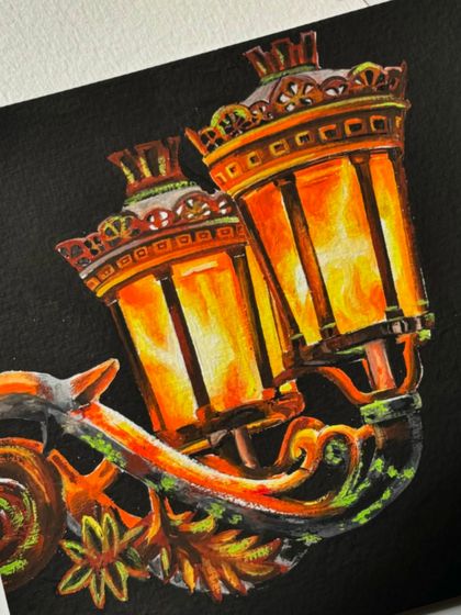 A close-up of the intricate details on the lantern painting. I used many layers of gouache to create the glowing effect.